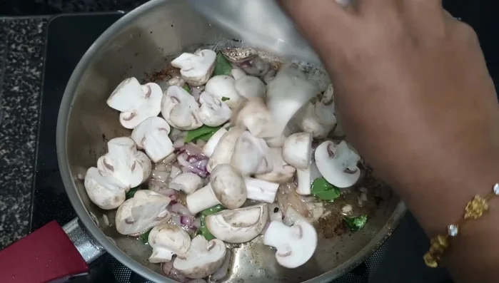Add mushrooms, salt, and turmeric. Fry for a couple of minutes, then close the lid and cook on high heat for a few minutes to release water.