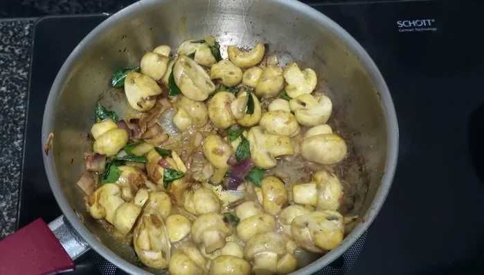 Remove the lid and continue frying until the water evaporates.
