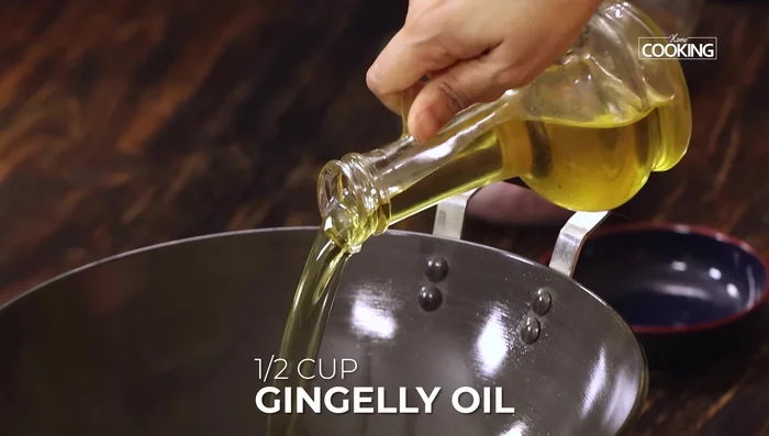 Heat gingerly oil in a pan. Add urad dal, mustard seeds, cumin seeds, and red chilies. Once mustard seeds splutter, add asafoetida powder.