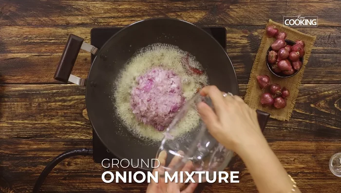 Add the ground onion mixture and stir well until the raw smell disappears and moisture evaporates.