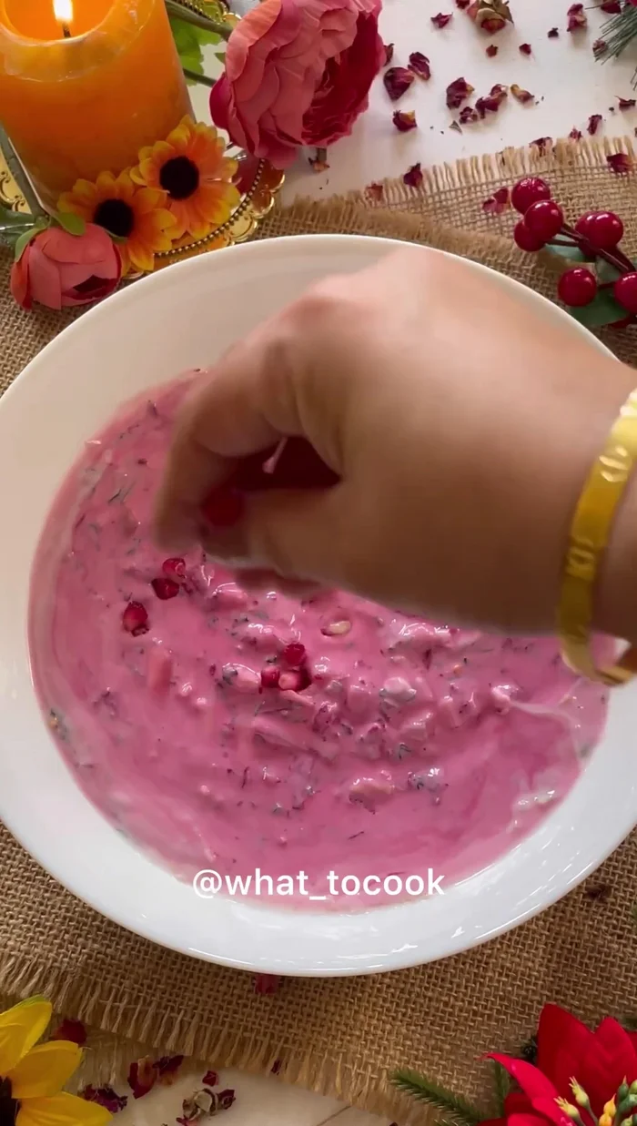 Garnish with pomegranate seeds, crushed red chili, and fresh coriander. Refrigerate before serving.