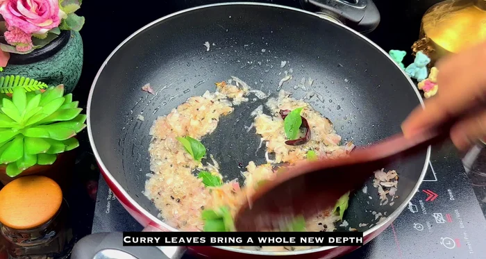 Add curry leaves, crushed ginger and garlic. Cook until the raw smell fades (about 30 seconds to a minute).