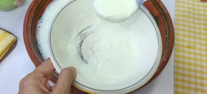 Mix 2 tablespoons of thick yogurt with 2 tablespoons of water to dilute it. This helps to distribute the starter evenly in the milk.