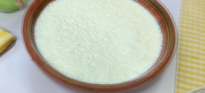 Add the diluted yogurt starter to the milk by slowly pouring it into the milk in multiple spots. Mix gently to incorporate the starter without overmixing.