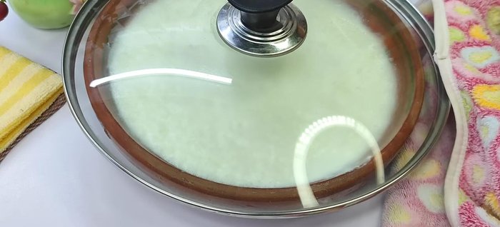 Cover the container and keep it in a warm place for 4-5 hours (or longer if your environment is cool) until the yogurt sets completely.