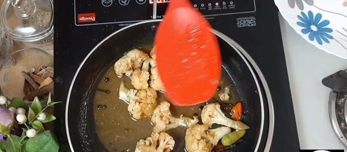 Add the cauliflower florets, cover, and let it cook until the cauliflower is tender.