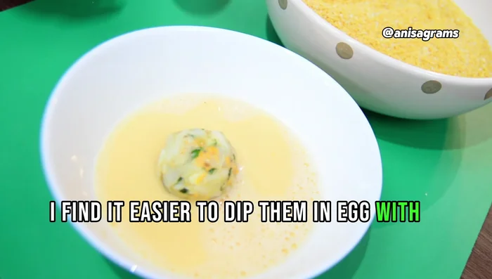 Dip the balls in beaten egg, then coat with breadcrumbs. Repeat for a double coating. (165.8)