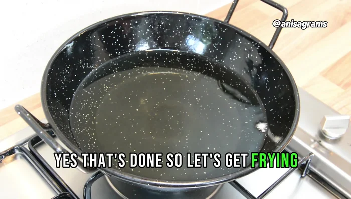 Heat oil in a pan and fry the chicken cheese balls on medium heat until golden brown. (201.959)