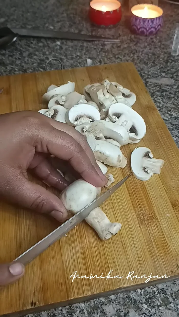 Add more oil to the pan. Wash the mushrooms thoroughly and cut them as desired. Fry the mushrooms until lightly browned.