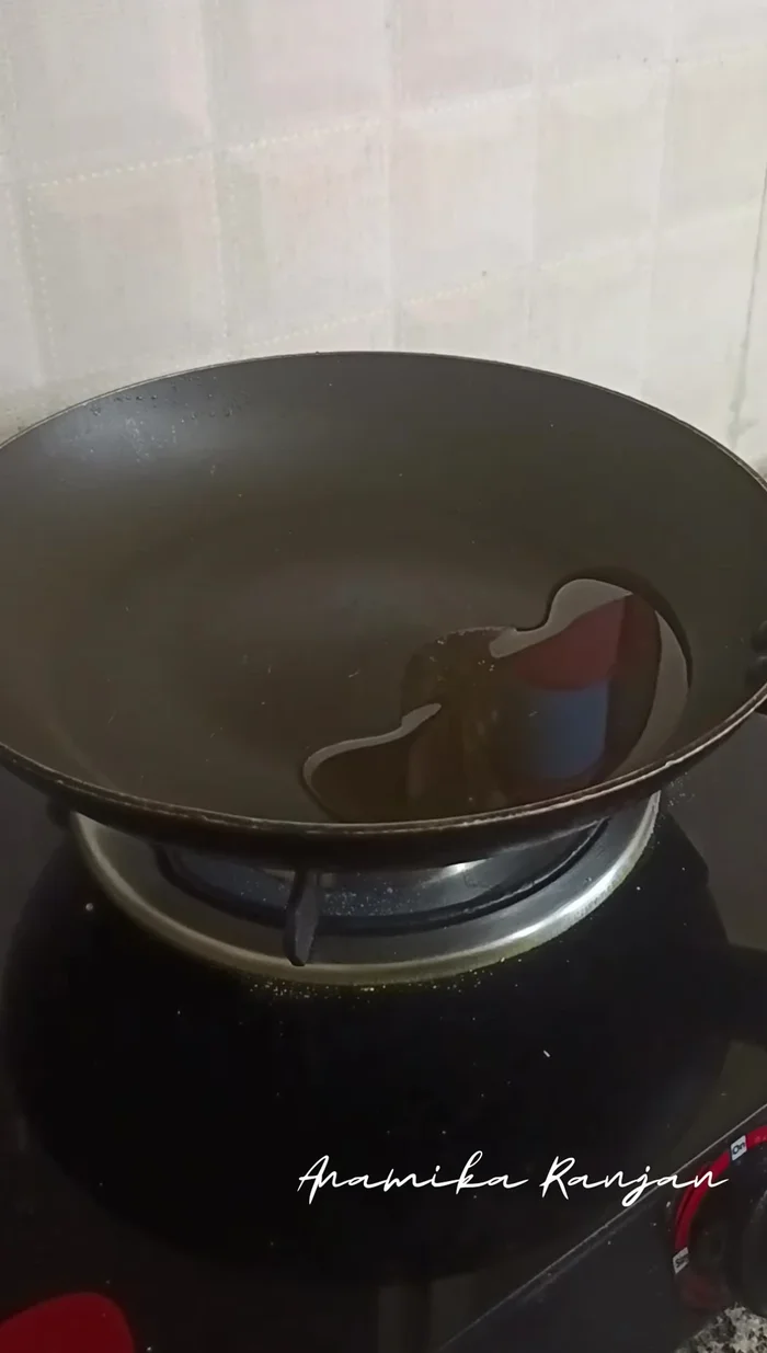 Heat mustard oil in a pan. Cut Amul paneer into cubes (size depends on preference).