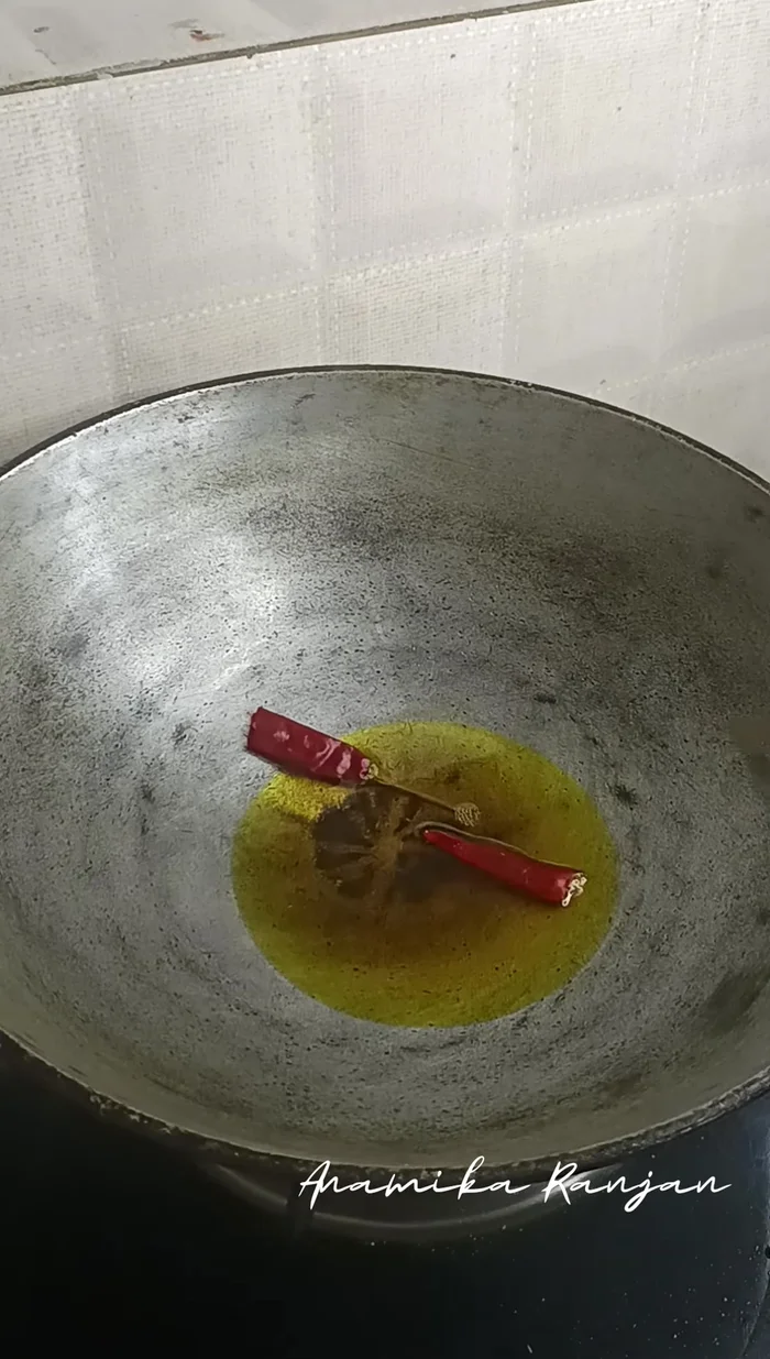 Prepare the gravy: In a pan, heat oil and add whole spices (dry red chili, bay leaf, garam masala).