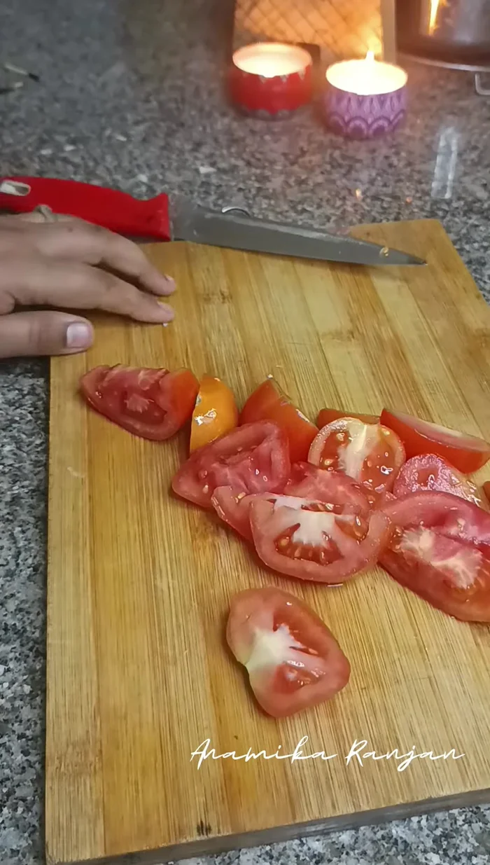 Add the tomato puree (blend 2 tomatoes with red chili powder).