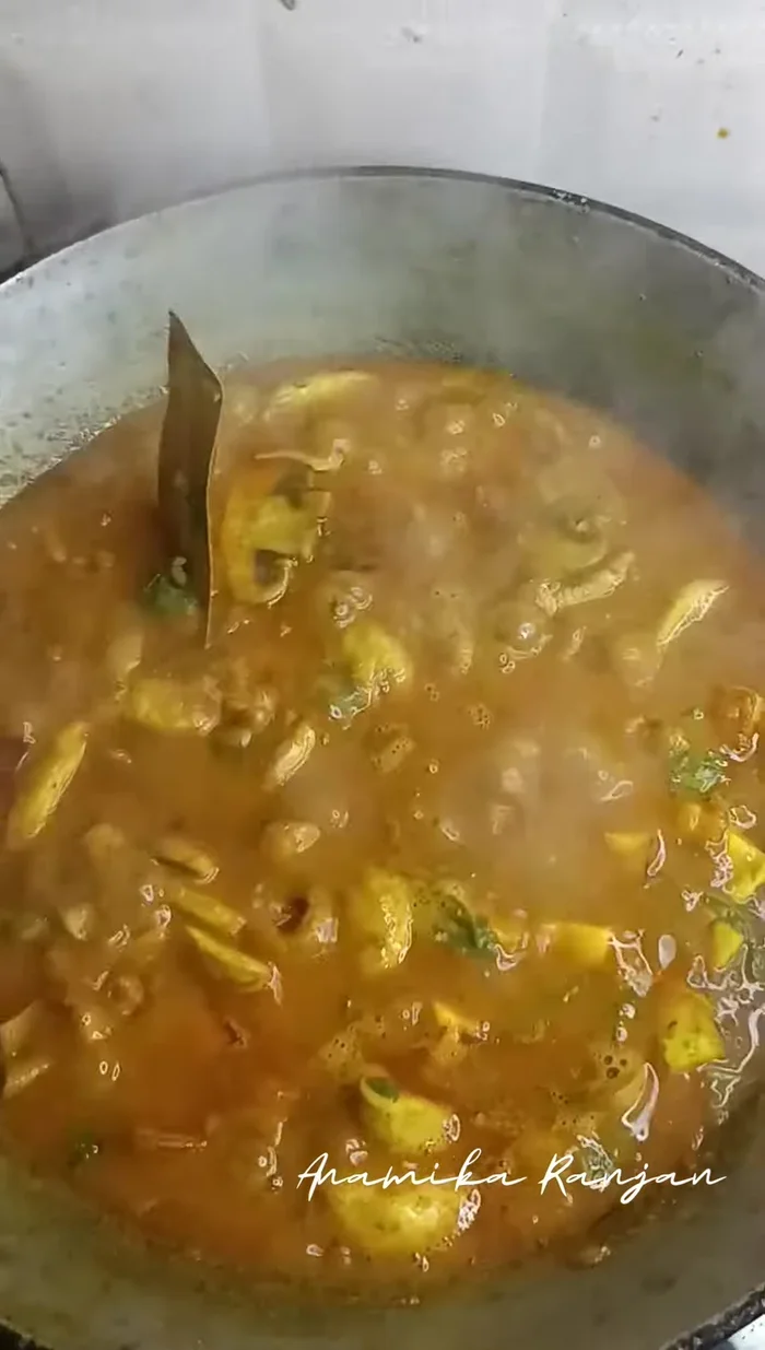 Garnish and serve with roti, rice, puri, or your preferred accompaniment.