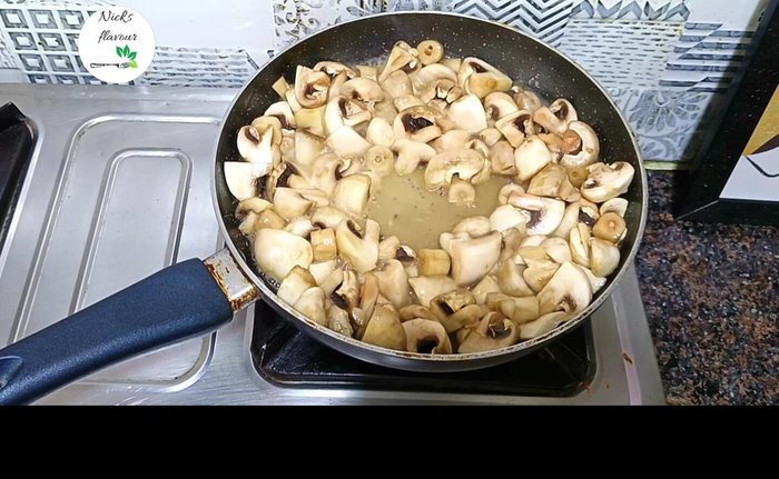 Once water releases, make space and add 2 tbsp finely chopped garlic and 1 finely chopped onion. Mix well. [107.159]