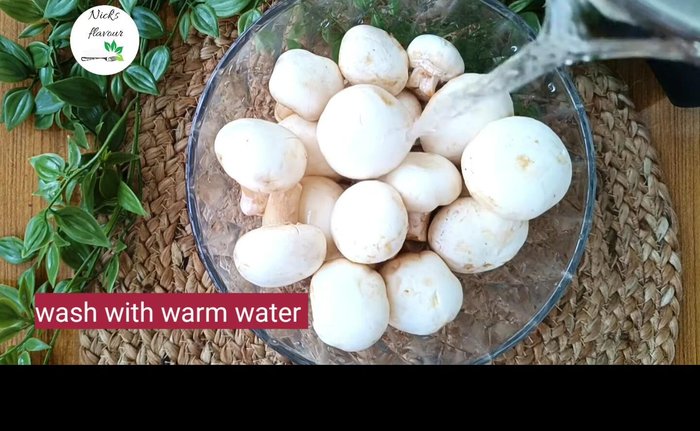 Put mushrooms in a bowl, add hot water, and scrub gently to clean thoroughly. [24.519]