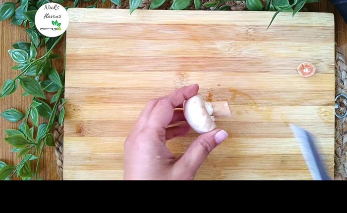 Cut each mushroom into thick pieces, including the stems. Cut larger mushrooms into four pieces, smaller ones into two. [47.28]