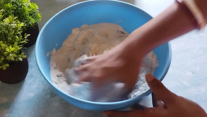 Add refined oil (or ghee) and mix thoroughly until the mixture resembles a crumbly dough.