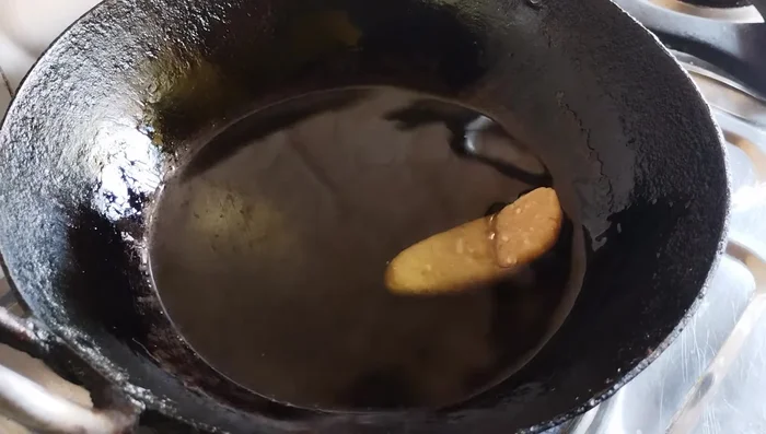 Heat oil in a pan to a moderately hot temperature (not too hot).