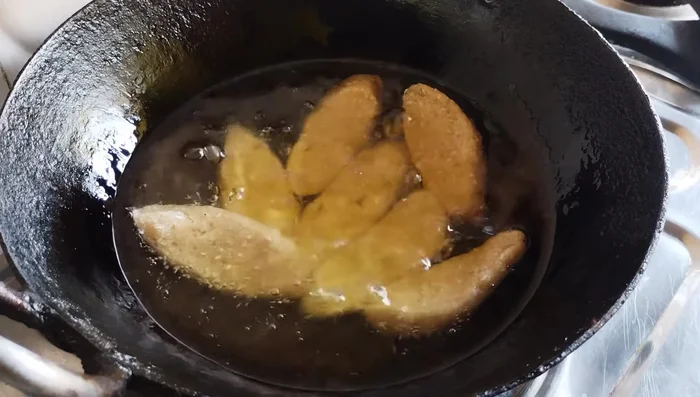 Fry the dates in batches on low heat, turning occasionally, until they are golden brown and crispy. Do not overcrowd the pan.