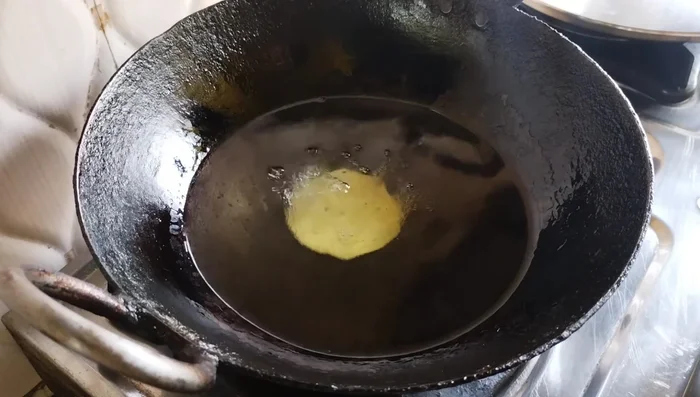 Heat oil in a frying pan. Fry the papdi on medium heat, stirring continuously until golden brown. This takes about 3-4 minutes per batch.