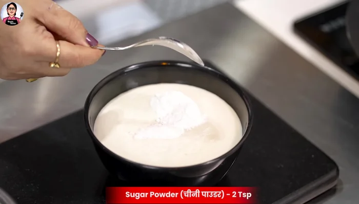Prepare the dosa batter: Add salt and powdered sugar to the fermented batter.