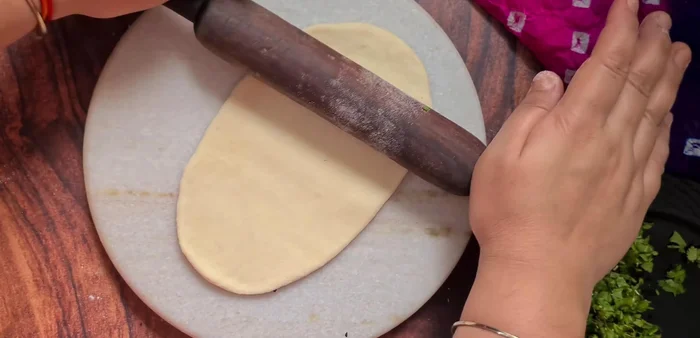 Heat a tawa (flat griddle) over medium-high heat.