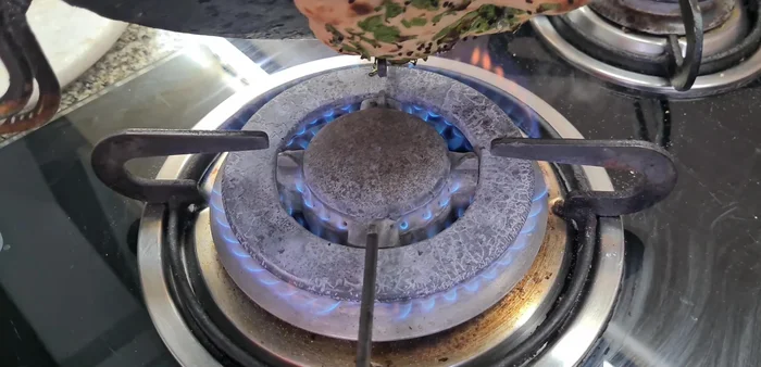 Flip and cook the other side until it puffs up and browns lightly. This takes about 2-3 minutes per naan.