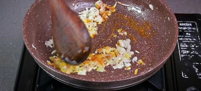 Add salt, turmeric, ginger-garlic paste, red chili powder, and chaat masala. Mix well and cook for 1-1.5 minutes. Add water if the masala becomes dry.