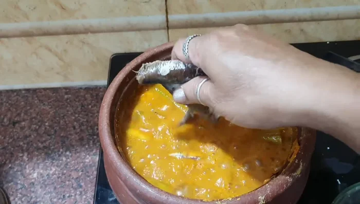Add the sarai fish to the gravy. Let it simmer for another 5 minutes.