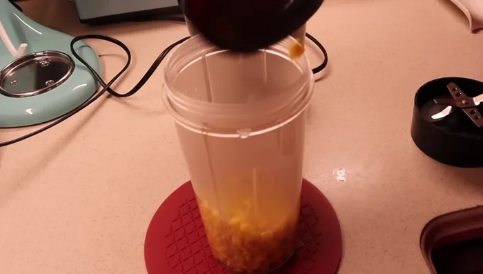 Blend the cooked corn with some water into a paste using a mixer.