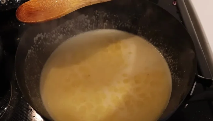 Add water to adjust the consistency, then add black pepper.