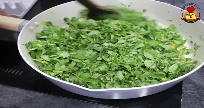 Reduce the flame, mix well, and add a little celery for color.