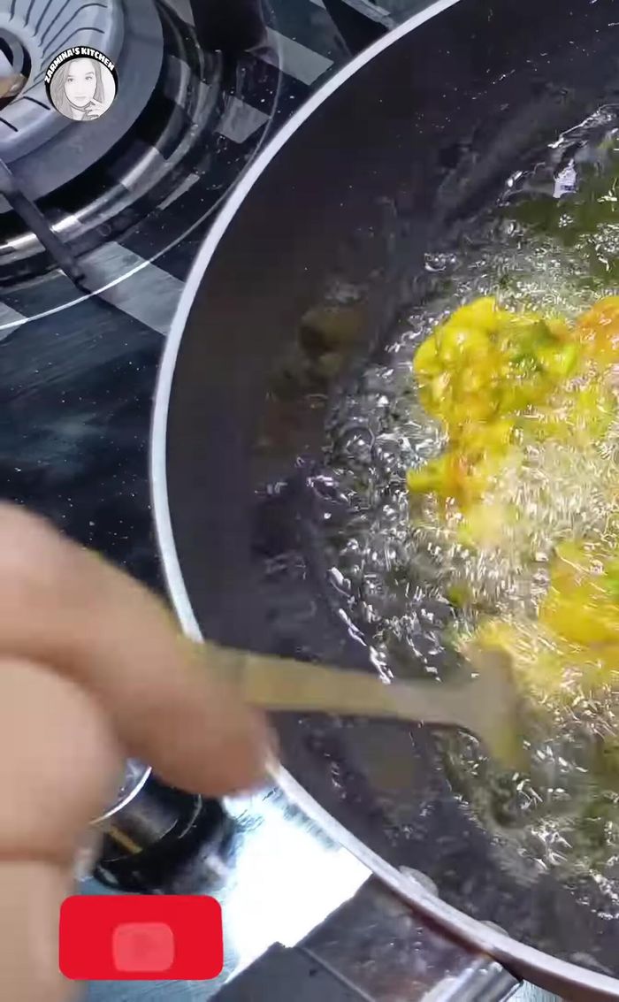 Let the pakoras cook undisturbed for 5 minutes, then gently flip and cook until golden brown on both sides. Reduce heat if needed to ensure even cooking.