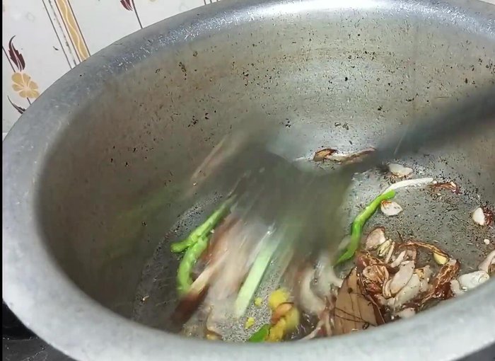Add ginger-garlic paste and fry until the raw smell disappears.