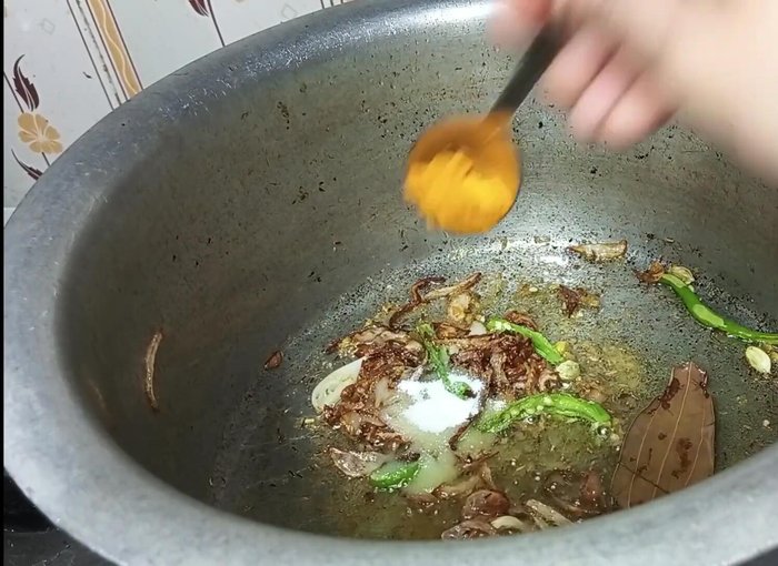 Add salt, turmeric powder, red chili powder, coriander powder, and garam masala. Fry well until the spices are fragrant.