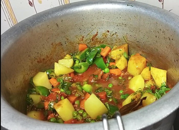 Add water, cover, and cook on medium flame for 10 minutes.