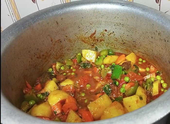 Drain the soaked rice and add it to the pan. Mix gently.