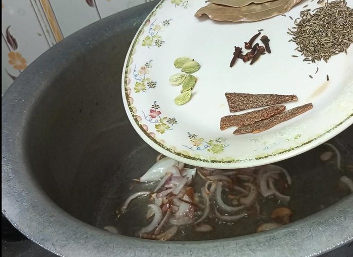 Add whole garam masala, shajeera, cloves, cardamom, cinnamon sticks, bay leaves, and green chilies. Fry well for a few seconds.