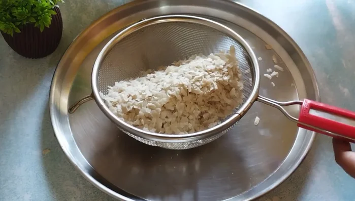 Sieve the poha to remove dust.