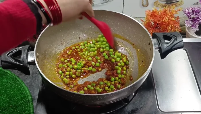 Add green peas and water (about 0.5 cup). Cover and cook on medium-low heat until peas are tender.