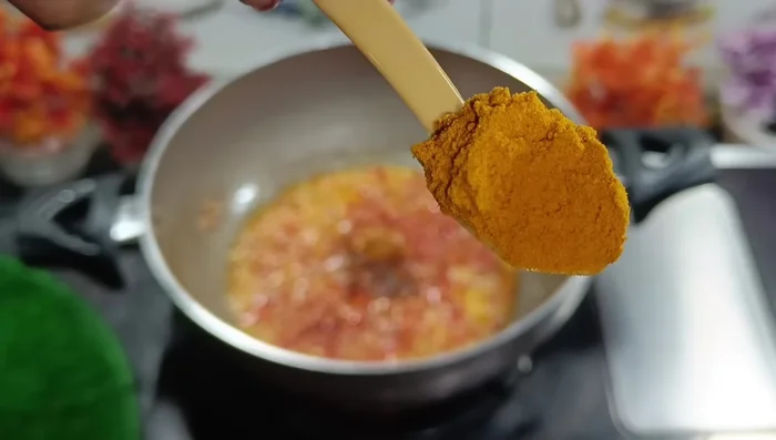 Add salt, green chilies, red chili powder, turmeric powder, cumin coriander powder, and cumin seeds. Mix well until spices are roasted.