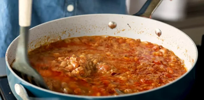 Stir in chopped spinach (fresh or frozen) and cook for 2 minutes (fresh) or 1 minute (frozen).
