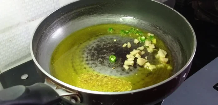 Add finely chopped onion, then fry until slightly softened.