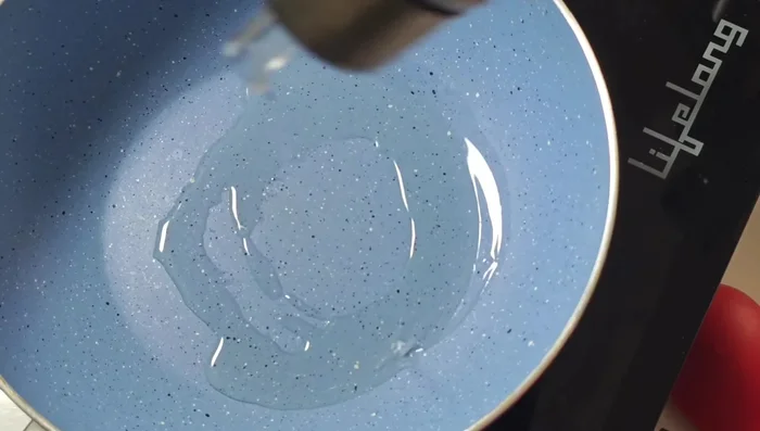 In a pan, sauté sliced onions until translucent.