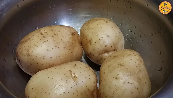 Boil potatoes: Add potatoes (with skin on) to a pan with enough water, 1 teaspoon of salt. Partially cover and cook for about 30 minutes, or until a fork easily pierces them.