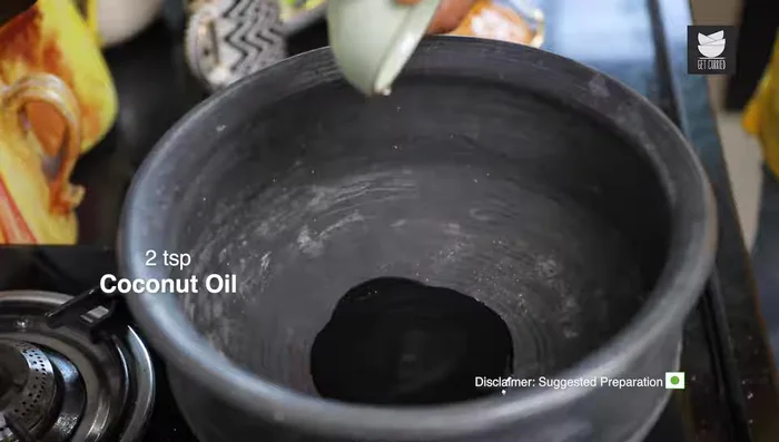 Heat coconut oil in a pan. Temper mustard seeds until they splutter, then add fenugreek seeds.