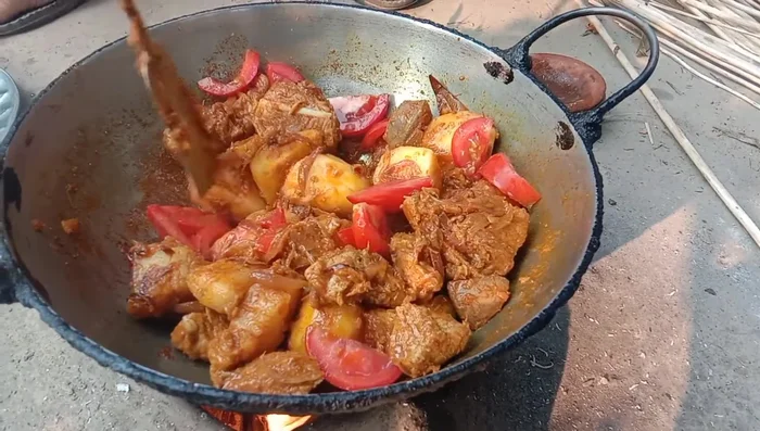 Add broth, cover the pan, and let it simmer.