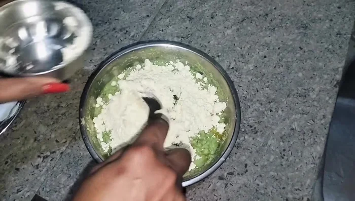 Add gram flour and mix well to form a dough.