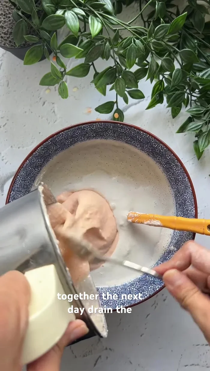 Drain the water and grind the dals separately.