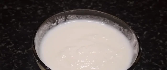 In a bowl, combine wheat flour, curd, salt, and baking soda.